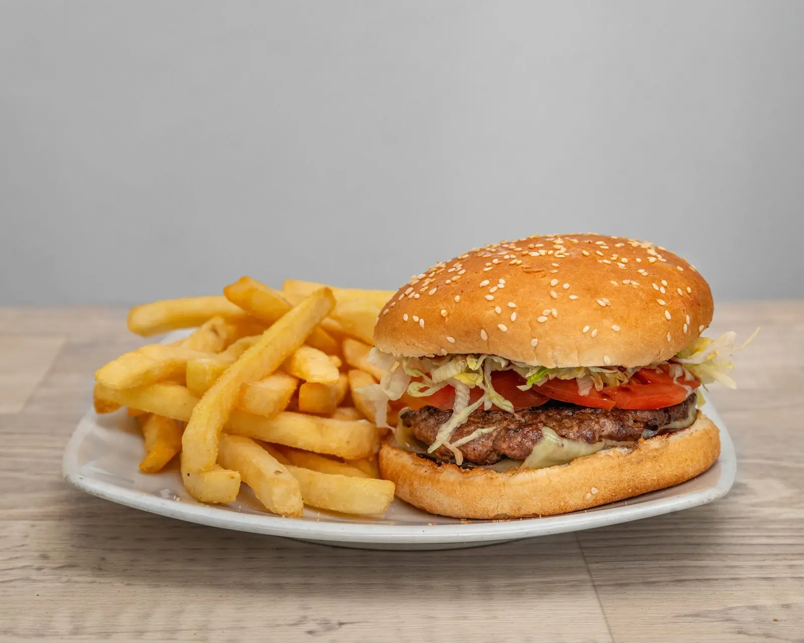 Beef burger with chips on a plate